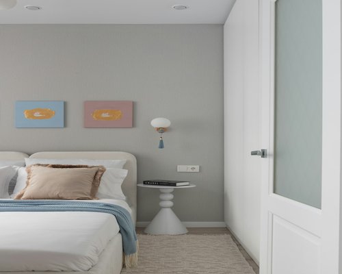 A quiet and clean bedroom environment with soft natural lighting conducive for deep rest